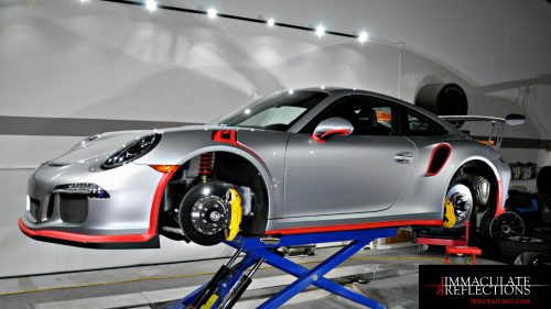 This Porche 911 was placed on the lift at Immaculate Reflections in order to more easily reach all areas for paint correction & ceramic nano coating.